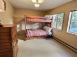 Bunk guest bedroom with storage and mountain views